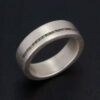 A focus on the detailed craftsmanship of our silver and rough diamond ring, where precision meets natural beauty.