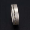 This silver and rough diamond ring as the epitome of urban chic, blending raw diamond beauty with sleek urban design.