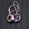 Capturing the sparkling allure of our checkerboard-cut amethyst earrings.