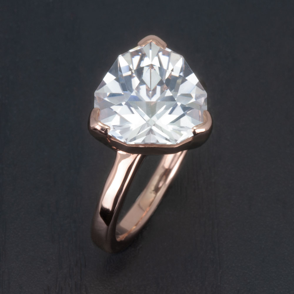 An eco-friendly choice for the conscious couple, this ring pairs 14k rose gold with a stunning lab-created white sapphire.