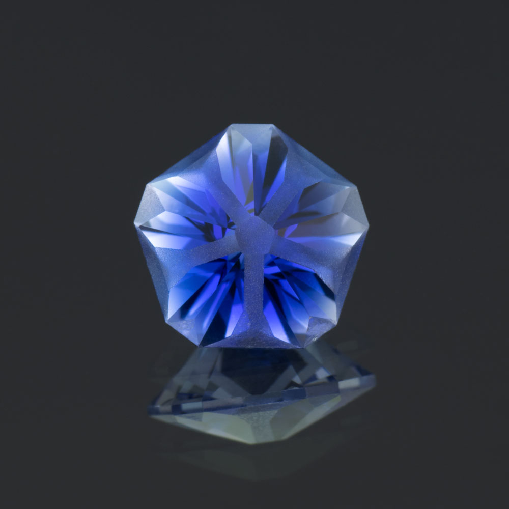 This is an image of a lab-created sapphire cut in the popular, but sometimes rare, Hanami cut.
