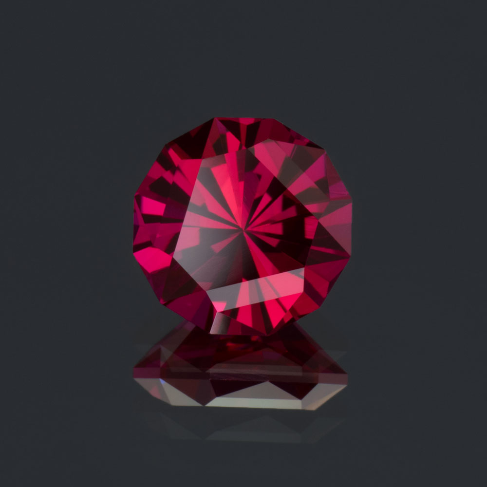An image of a 2.28 carat lab-created ruby custom cut in a design called "Trimystical".
