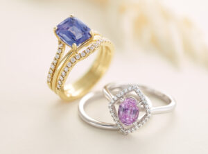 An image of two gemstone engagement rings.