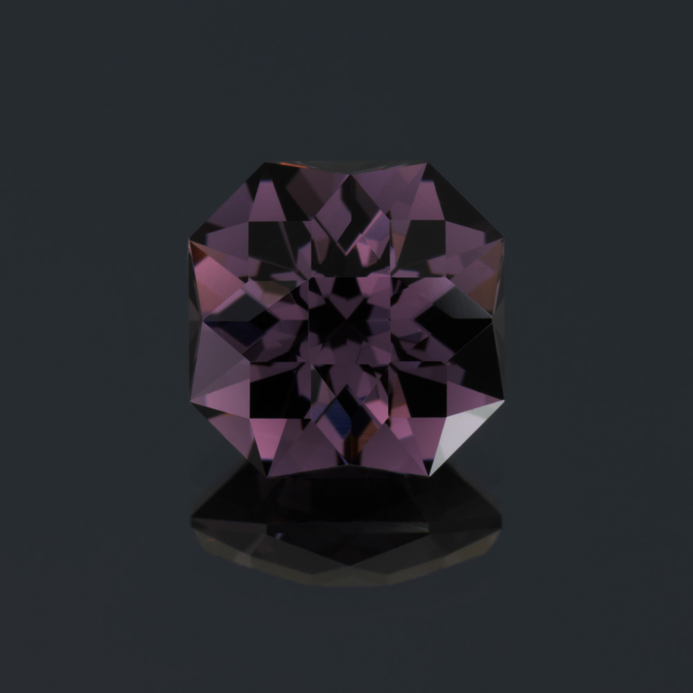 An image of a deep purple spinel, square cut.