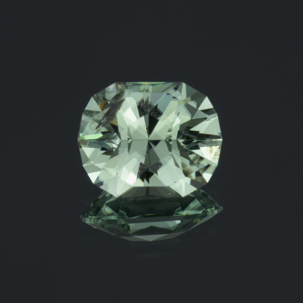 An image of a mint green tourmaline, custom faceted in house by us.
