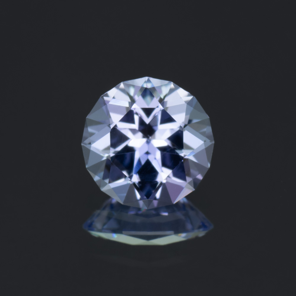 A 0.67 carat round blue-purple tanzanite.